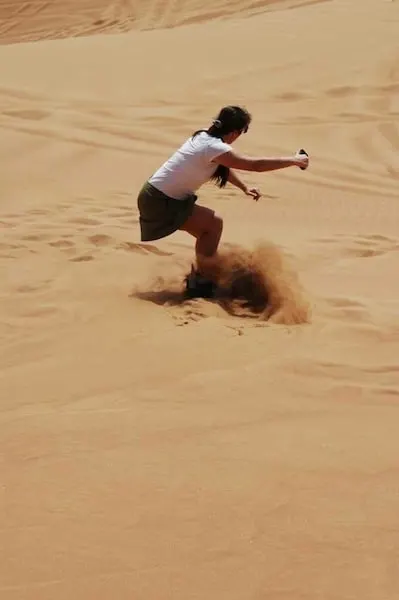 carving it up sandboarding in Dubai Traveling Well For Less