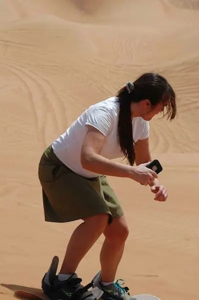 self filming while sandboarding in Dubai Traveling Well For Less