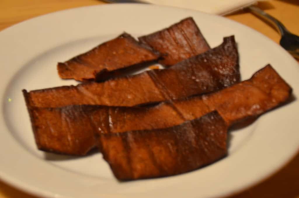 Vegan friendly bacon made from red lentils at Hugo's Restaurant. TravelingWellForLess.com