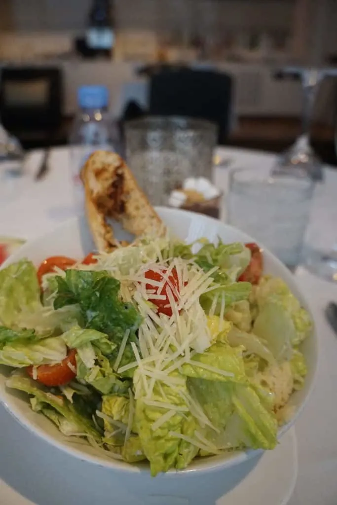 A Caesar salad with prawns (or without) is one of the items you can order from the First Class menu in the Star Alliance First Class Lounge at Los Angeles Airport. TravelingWellForLess.com