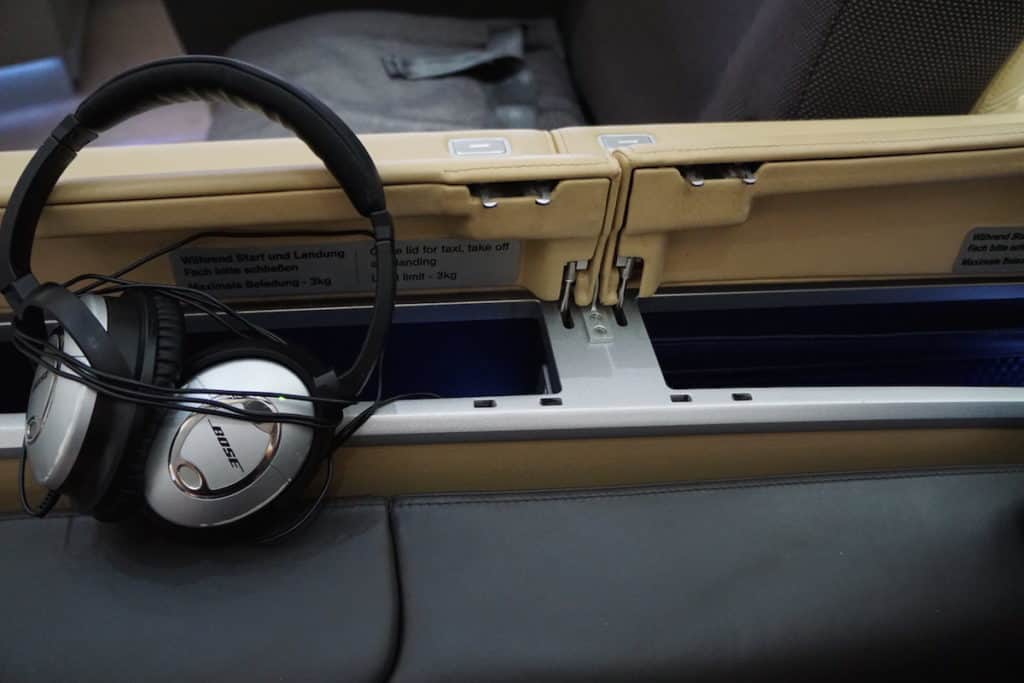 You can store your phone or tablet next to your seat. https://www.travelingwellforless.com