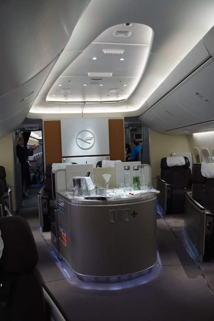 The First Class bar on Lufthansa 747-8 is in front of seats 3D and 3K. Learn how to score a First Class seat for $40. | travel hacking| Traveling Well For Less