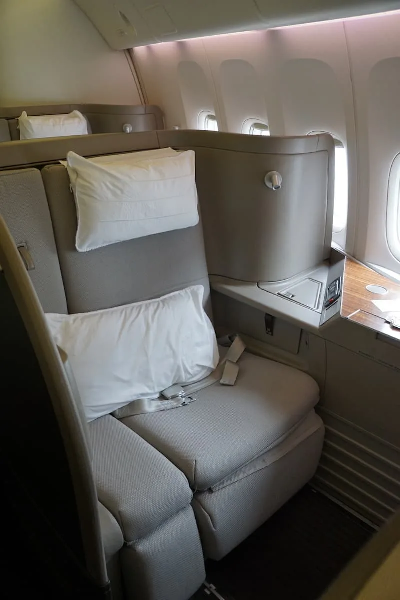 Get free airline tickets including First Class on Cathay Pacific by using travel rewards points. | How to travel for free | Traveling Well For Less |