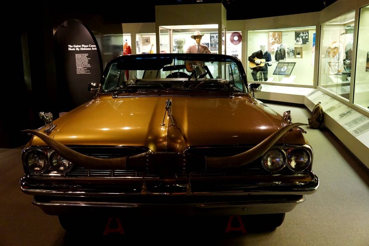 "Golden Country Car”, a 1960 Pontiac convertible decorated with silver dollars and silver guns on exhibit at the Alabama Music Hall of Fame. | 25 reasons to visit Florence, Alabama. | TravelingWellForLess.com