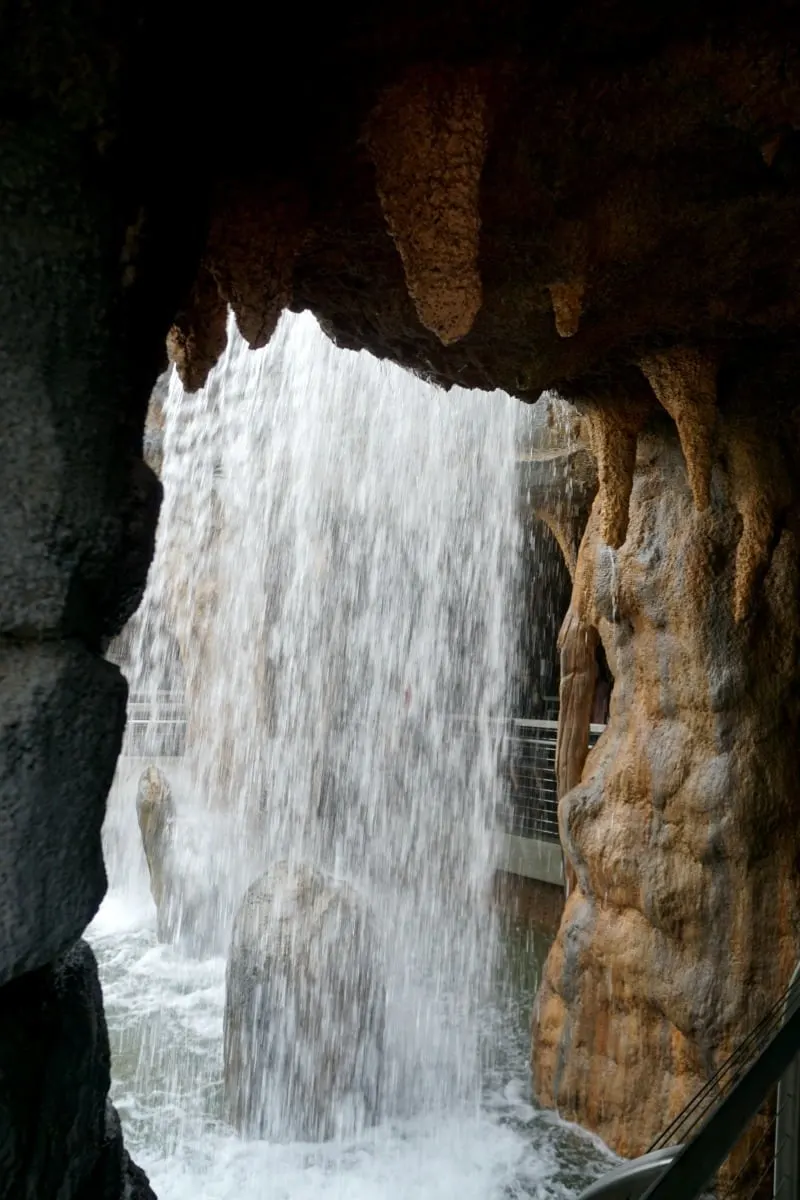 Explore the grotto behind Rady Falls. | @sandiegozoo. | #AfricaRocks | #ad | Conrad Prebys Africa Rocks | San Diego Zoo | things to do in San Diego | TravelingWellForLess.com