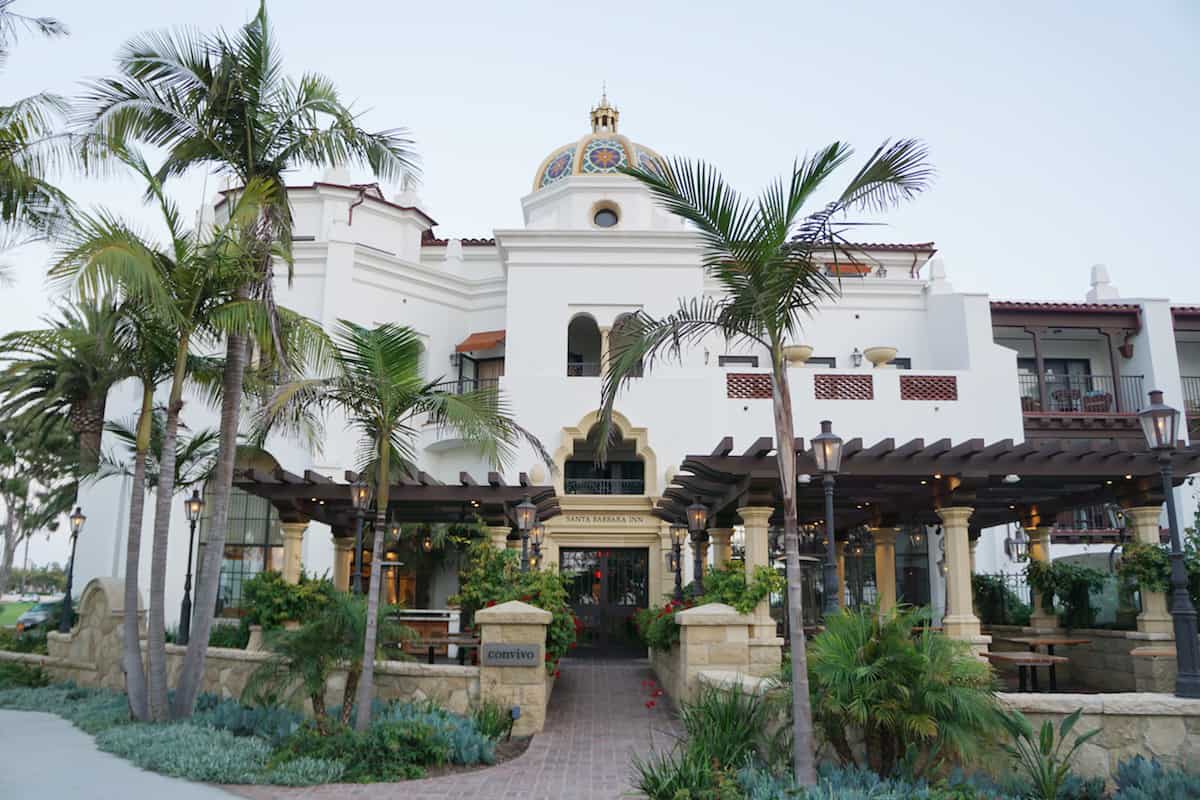The Santa Barbara Inn is a boutique hotel with 70 rooms including suites. Every room offers a view of the ocean, Channel Islands, Stearns Wharf, or Santa Ynez Mountains. With a California Mission, Spanish Mediterranean architecture style, the hotel only looks expensive. | Where to stay in Santa Barbara | Santa Barbara beachfront hotel | California | American Riveria | www.TravelingWellForLess.com