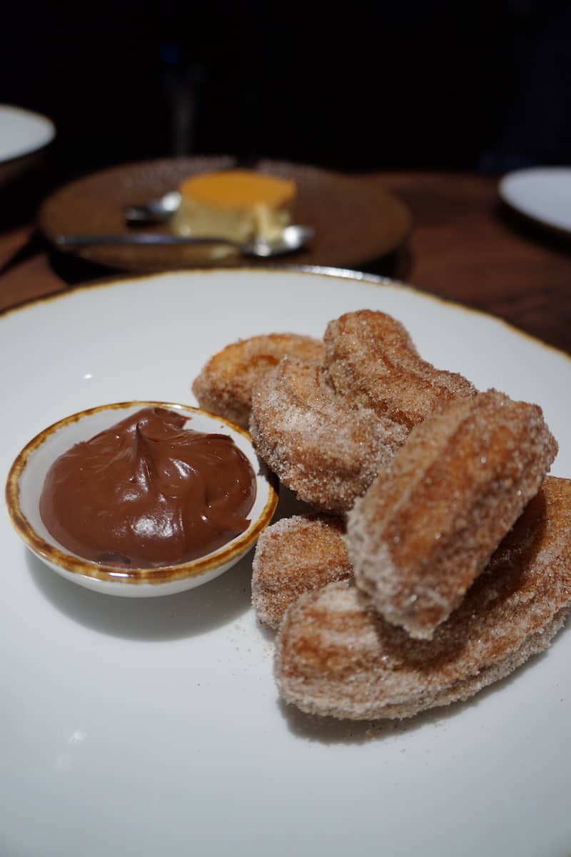 These mini churros are dusted with espresso and sugar. Dip into the thick pudding-like spicy chocolate sauce for a kick. | Dublin, Ohio | Columbus | Spanish food | where to eat in Columbus | TravelingWellForLess.com