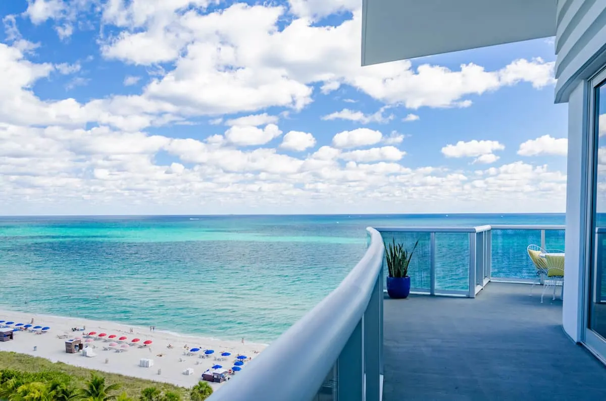 View of Atlantic Ocean from suite at Confidante Miami hotel. Want free upgrades and other perks? Read our ultimate guide on how to get VIP treatment at hotels. https://www.travelingwellforless.com