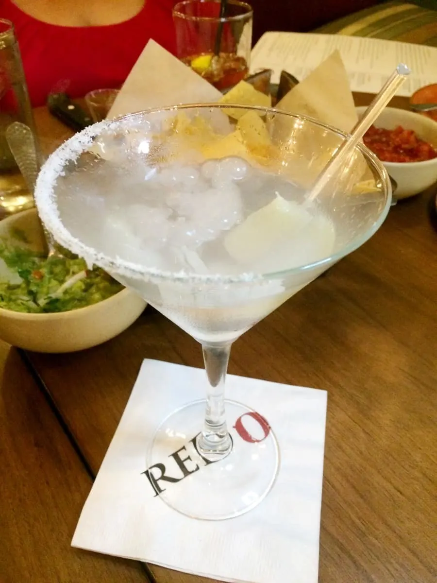 Dry ice creates the bubbling effect on the martini inspired Casa Blanca Margarita. | Rick Bayless | Red O | Where to eat in San Diego | Mexican restaurant | TravelingWellForLess.com