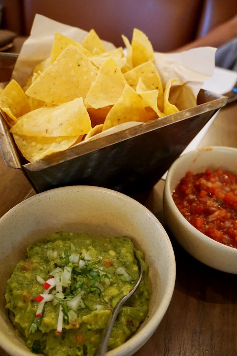 The Classic Guacamole at Red O beckons you with creamy chunks of soft ripe avocados and hints of tomatoes and onions. Almost daring you not to break your tortilla chip as you dip into its deliciousness. | Rick Bayless | Where to eat in San Diego | Mexican restaurants | TravelingWellForLess.com