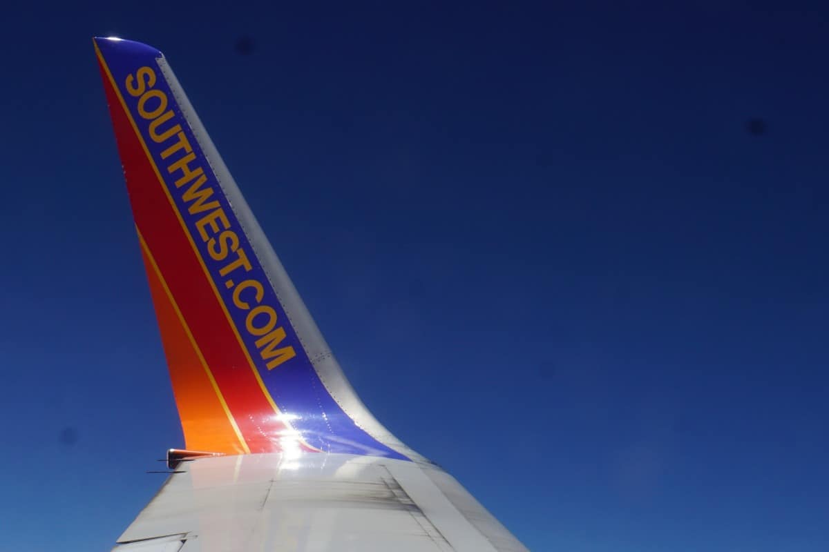 Tail of Southwest Airplane. Get a free Southwest Status match.