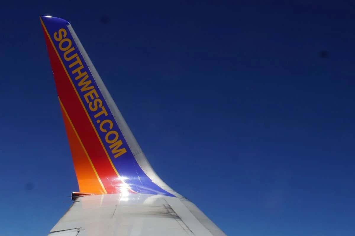 Tail of Southwest Airplane. Get a free Southwest Status match.