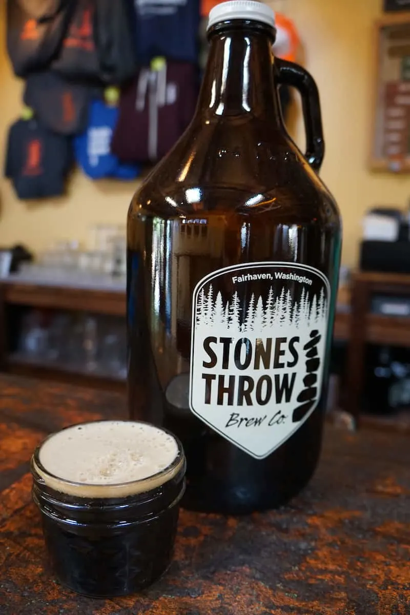 Constructed out of shipping containers and built on the site of a former brothel, Stones Throw Brewing has an outdoor area, deck, and a bar with refrigerated pint holders. #craftbeer #beer #brewery #Bellingham #Washington
