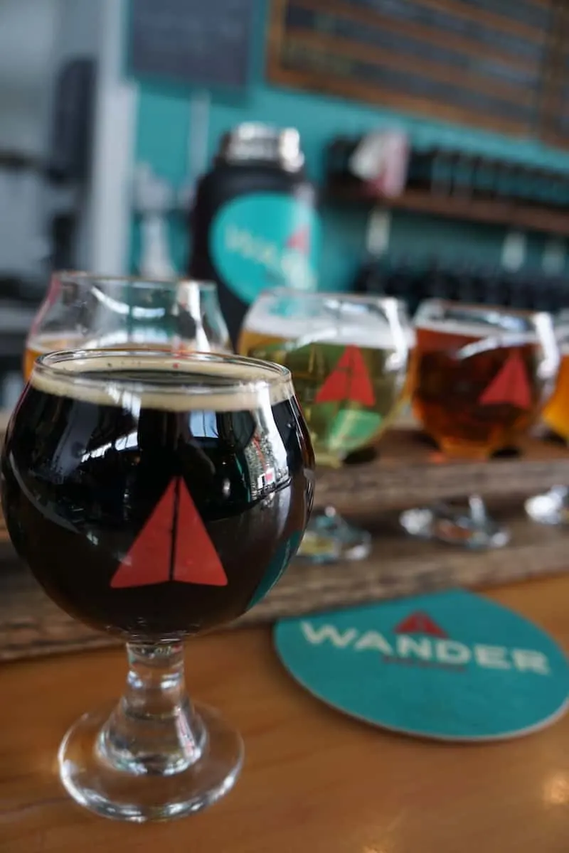 Award-winning Wander Brewing is a local and visitor favorite. Travelers will love Wander Brewing's paper airplane logo. #craftbeer #beer #brewery #Bellingham #Washington