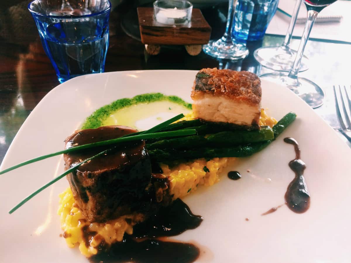 The rich Pork Loin and Braised Pork Belly with Risotto is worth every clogged artery. | Bellingham, WA | where to eat in Bellingham, WA | farm to table | french restaurant | TravelingWellForLess.com