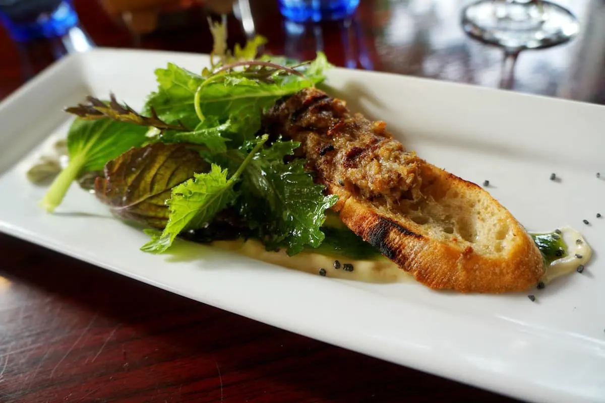 Spiced sage and Sky Farm Lamb baguette with basil creme fraiche and eggplant puree appetizer was a great way to start the meal. | Bellingham, WA | where to eat in Bellingham, WA | farm to table | french restaurant | TravelingWellForLess.com