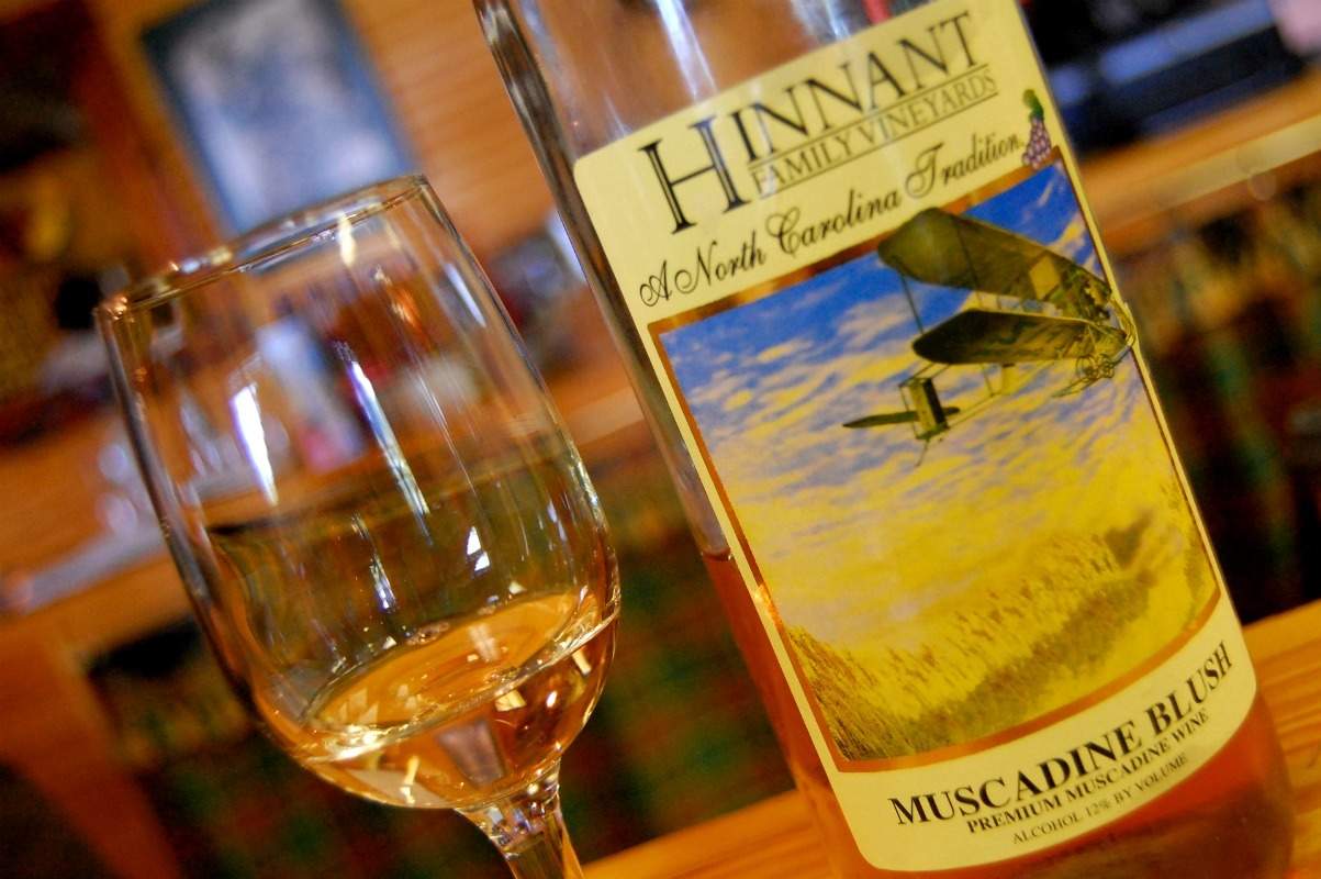 Muscadine wine is a semi-sweet wine made from American grapes. It's one of a few wines that have tremendous health benefits. | muscadine wine | Beer, wine, and shine trail | Things to do in Johnston County, North Carolina | wine | TravelingWellForLess.com