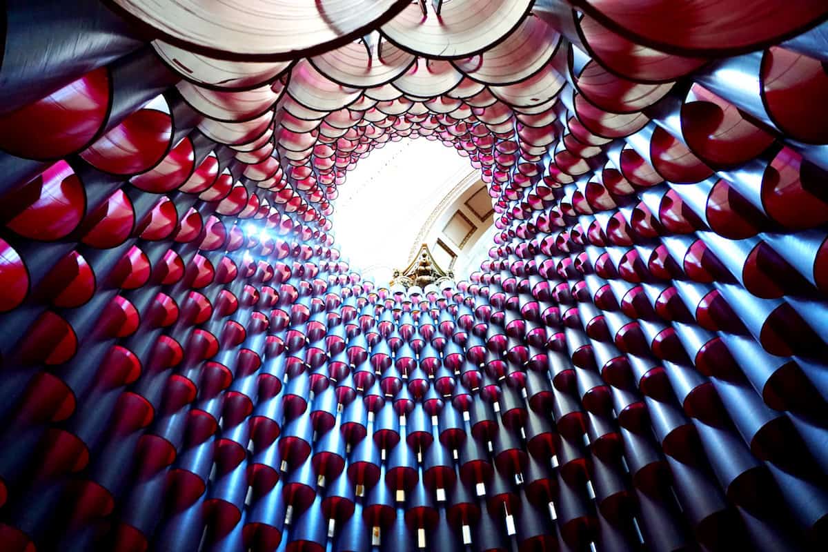 A 60-foot hive shaped structure made from 2,700 industrial sized paper tubes at the National Building Museum | what to do in Washington, DC | museums | modern art | TravelingWellForLess.com