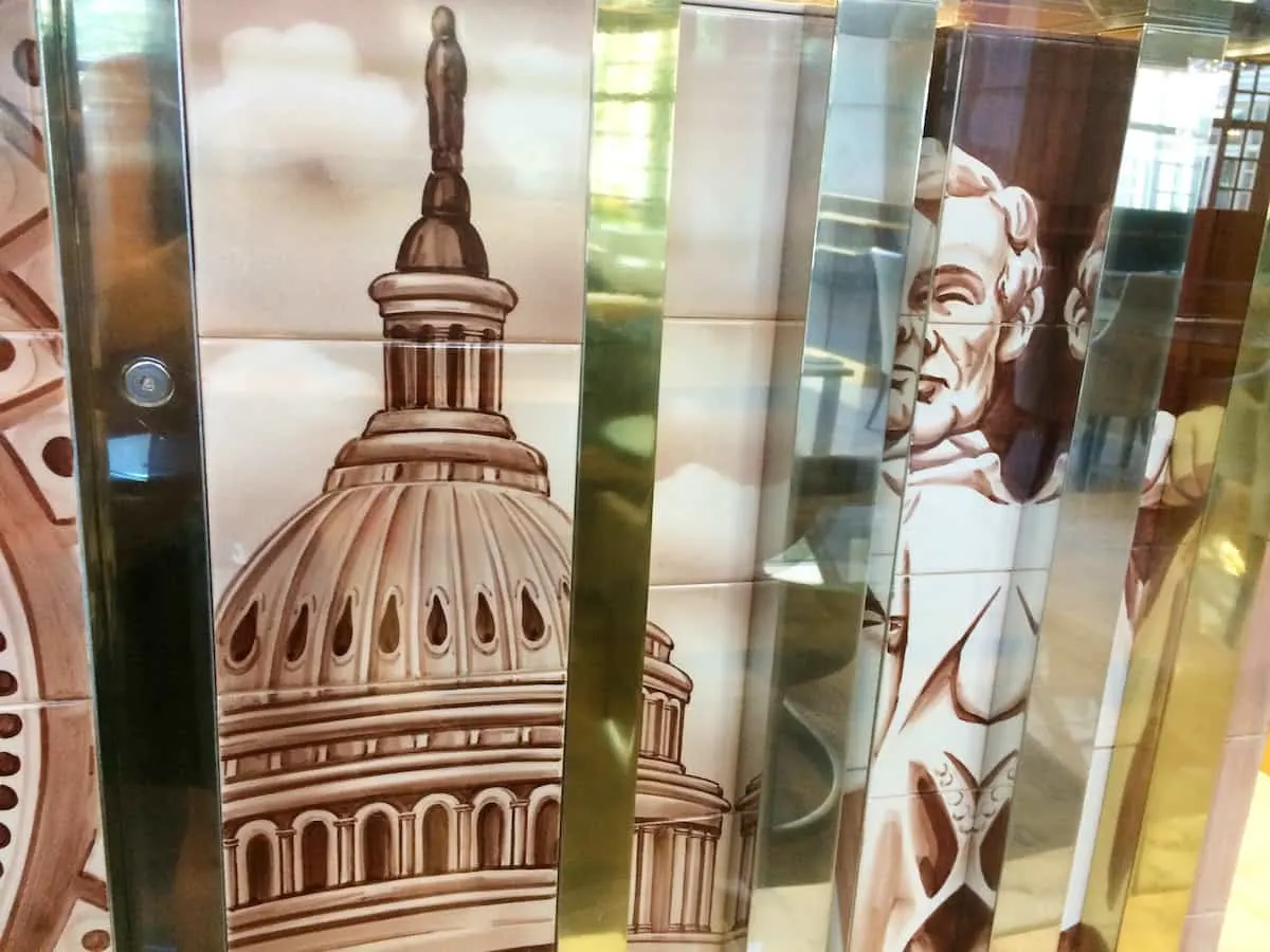 Before you rush to check-in, take a moment to stop and look at the glass topped table. The base features white tiles of past presidents, notable Washington, DC landmarks. | Fairmont Washington DC | Fairmont Gold | luxury hotel | where to stay in Washington DC | TravelingWellForLess.com