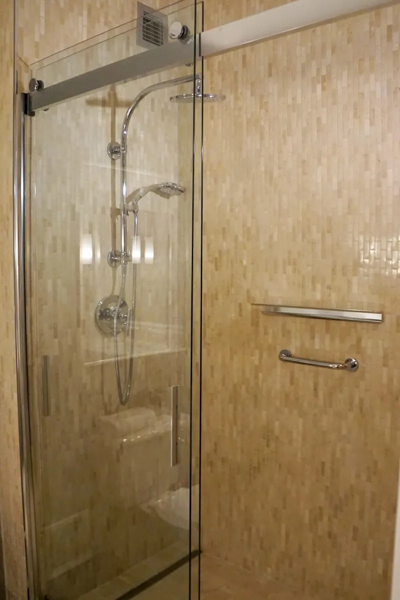 Large walk-in showers include a fixed shower head and an adjustable hand-held shower head. Water temperature and pressure were perfect. | Fairmont Washington DC | Fairmont Gold | luxury hotel | where to stay in Washington DC | TravelingWellForLess.com