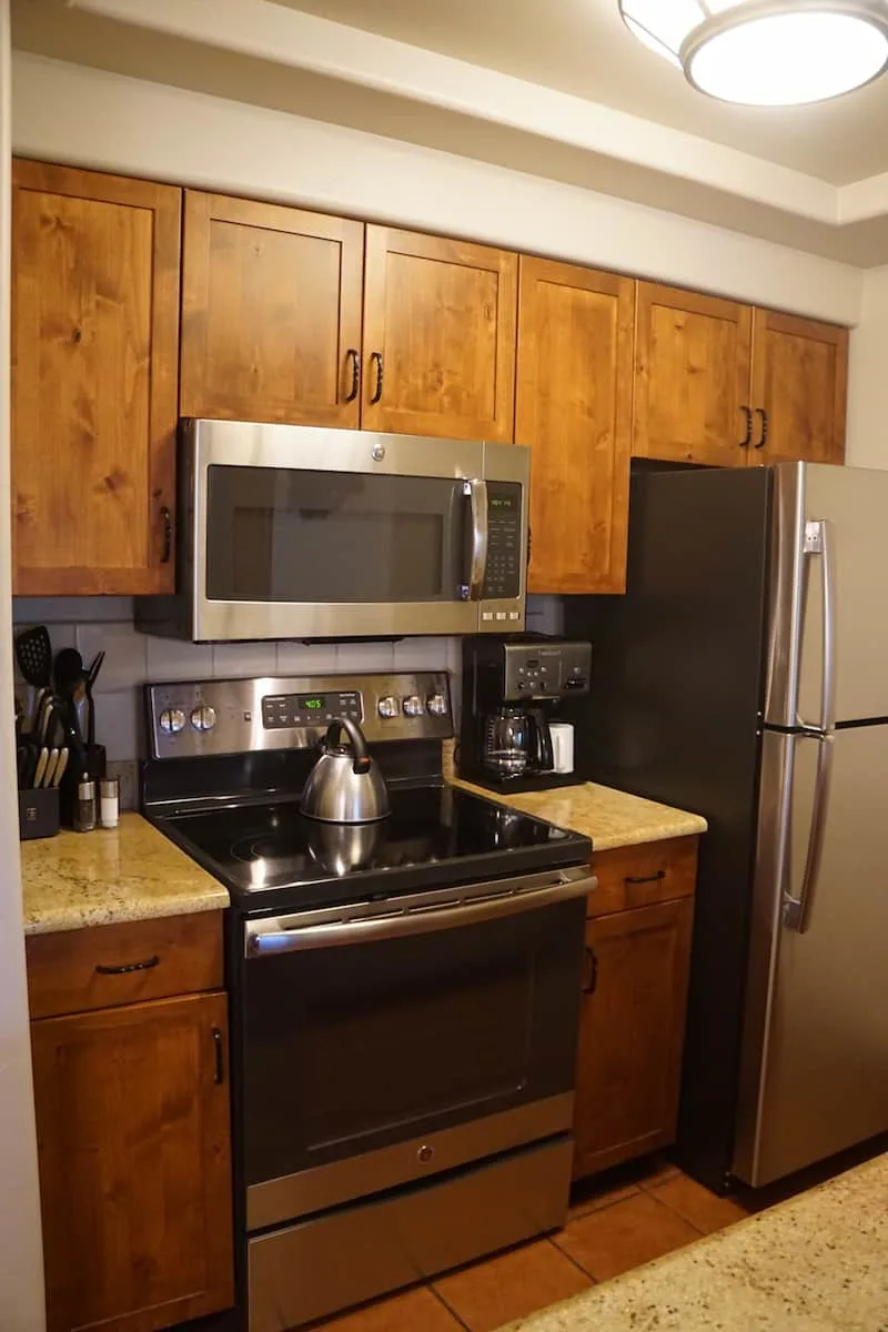 The full kitchen has all the cooking pots, pans, utensils, plates, glasses, and silverware you'd need to make a meal or heat up leftovers in the microwave.