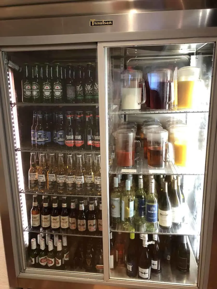 Beer, wine, and juices in self-serve fridge Star Alliance Business Class lounge LAX