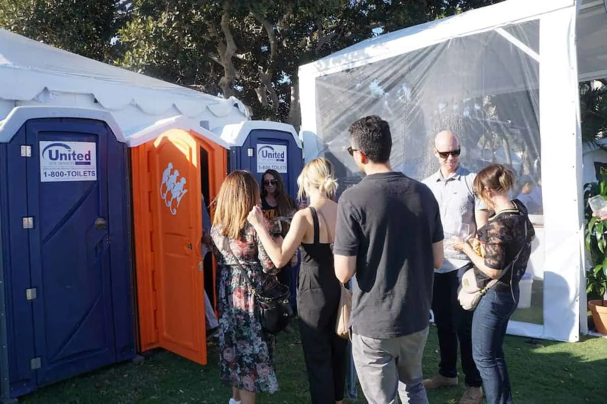 The long line for the orange porta-potty, it's not what you think. Behind that orange door is the Monkey Shoulder Speakeasy. | San Diego Bay Wine and Food Festival | SommCon | Vault | wine | TravelingWellForLess.com
