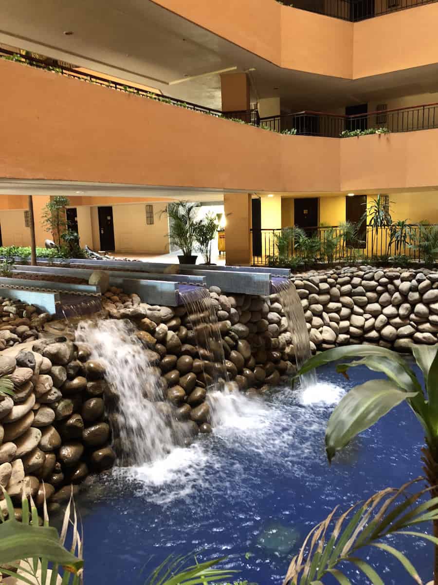 Doors in other tower face an atrium with a waterfall. | Marriott Puerto Vallarta Resort & Spa | where to stay in Puerto Vallarta | www.TravelingWellForLess.com