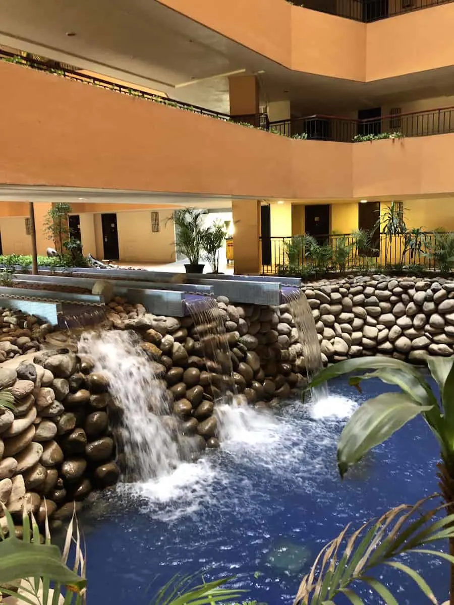 Doors in other tower face an atrium with a waterfall. | Marriott Puerto Vallarta Resort & Spa | where to stay in Puerto Vallarta | www.TravelingWellForLess.com