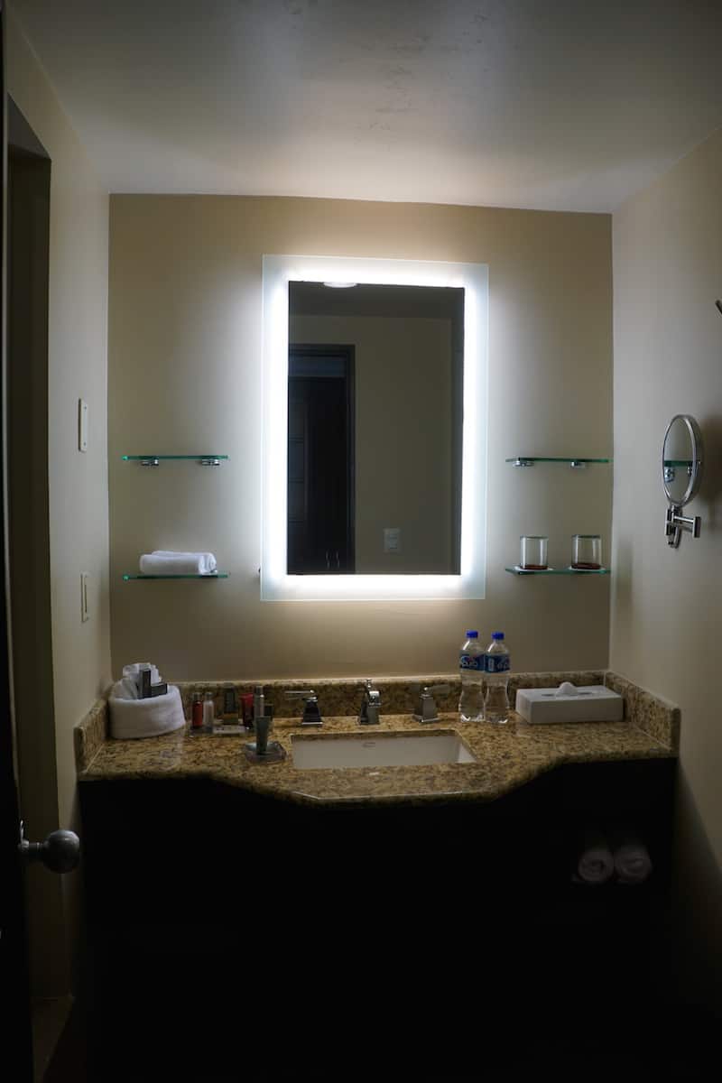 The sink is in the middle. The anti-fog mirror means your hot shower won't steam up the mirror. | Marriott Puerto Vallarta Resort & Spa | where to stay in Puerto Vallarta | www.TravelingWellForLess.com