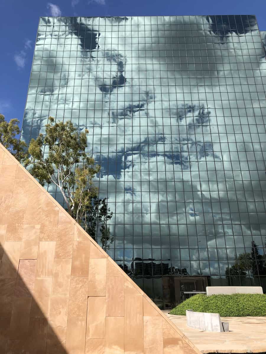 Clouds reflected in mirrored building surrounding Noguchi Garden, best things to do in Costa Mesa