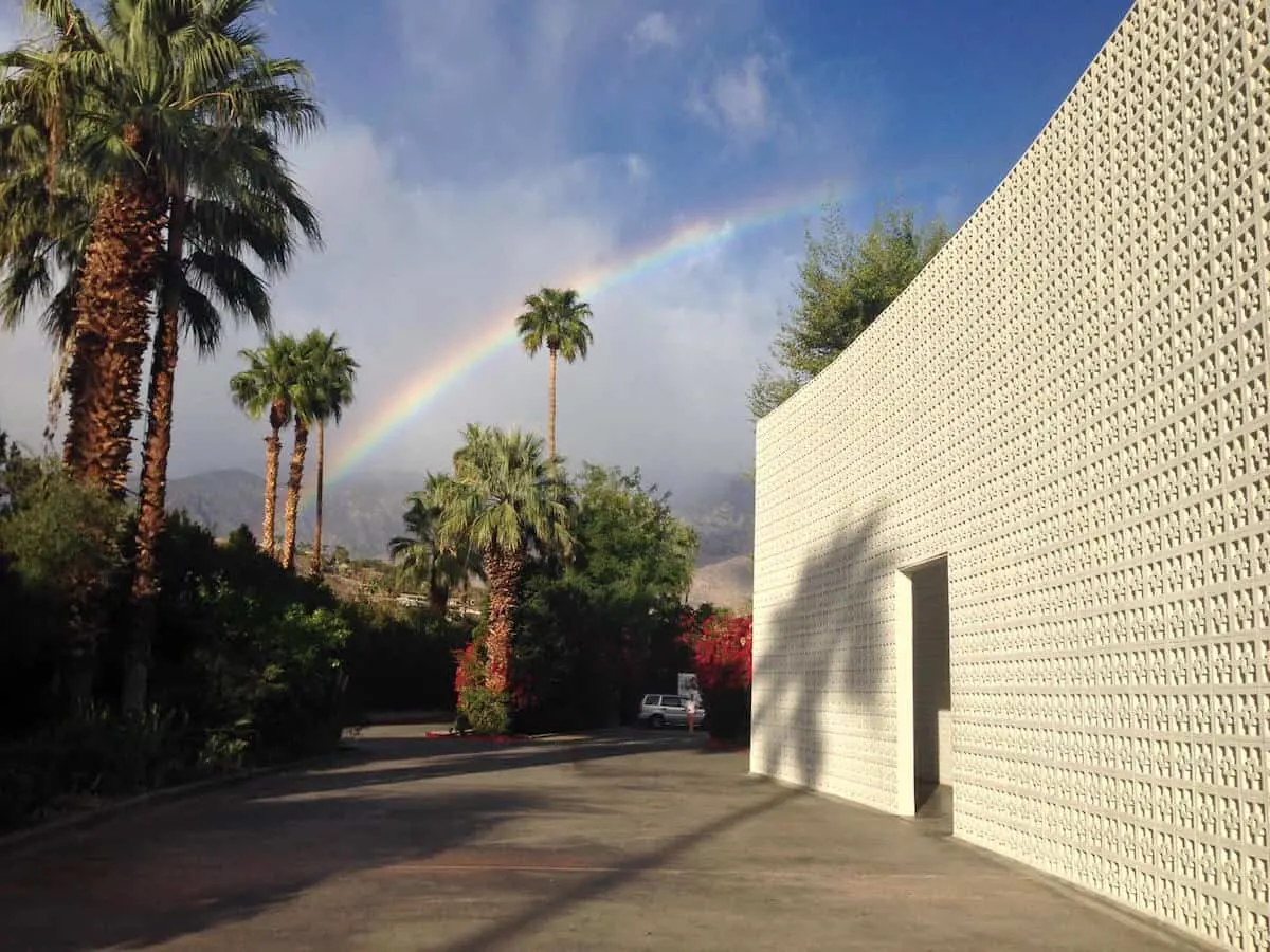 rainbow in sky over parker palm springs front entrance