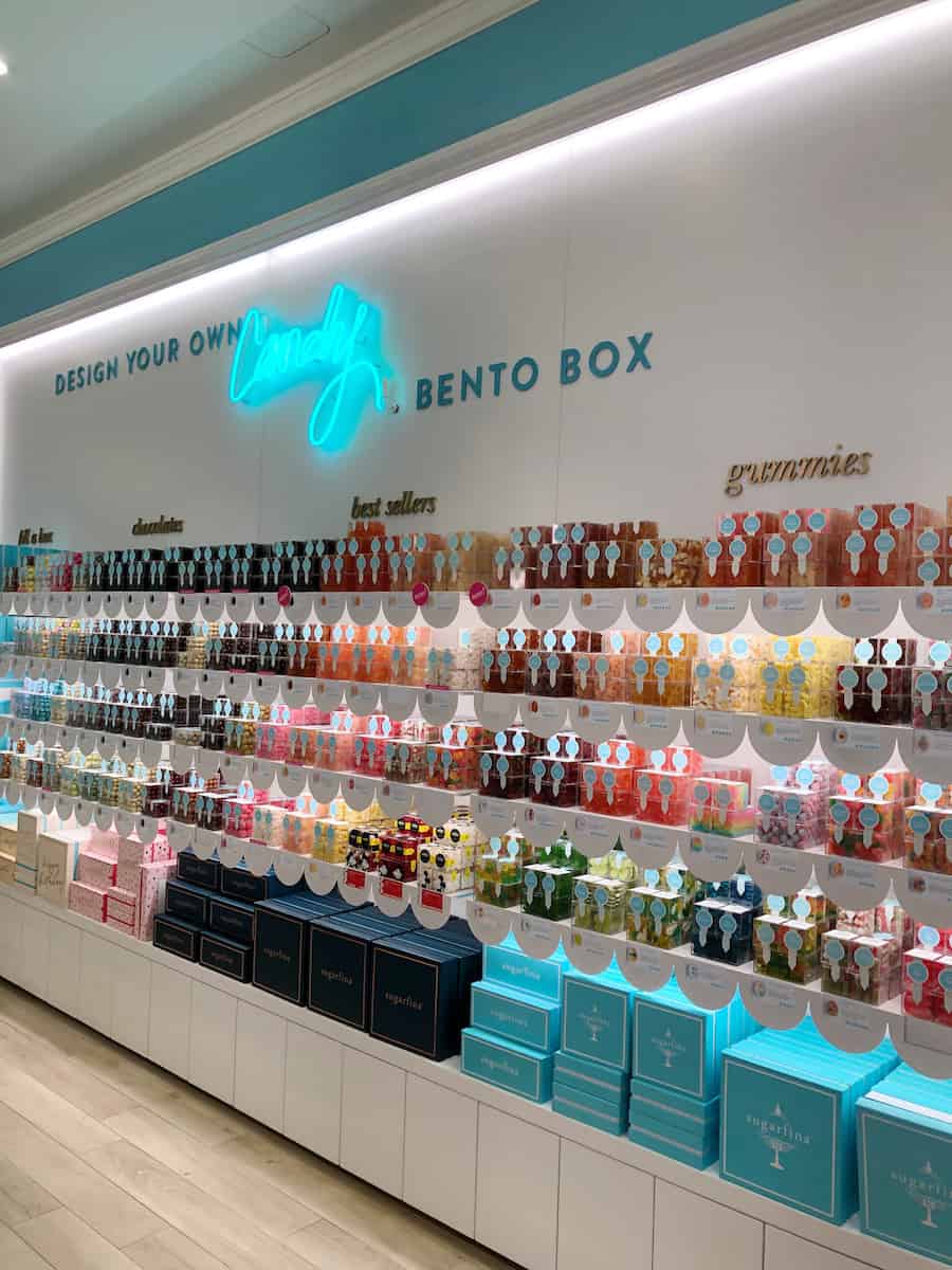 view of Sugarfina gourmet adult candy display at the South Coast Plaza, one of the best things to do in Costa Mesa