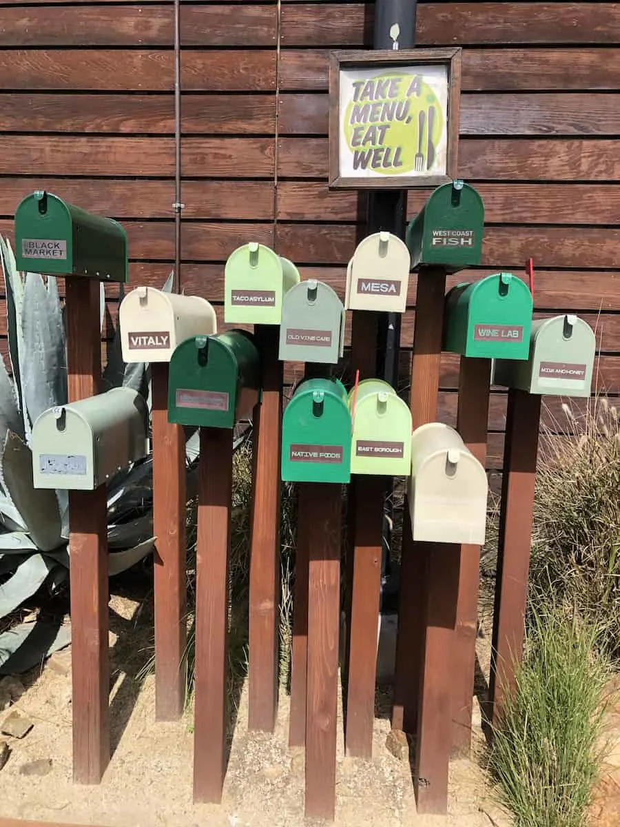 Mailboxes of menus for The Camp restaurants, one of the best things to do in Costa Mesa