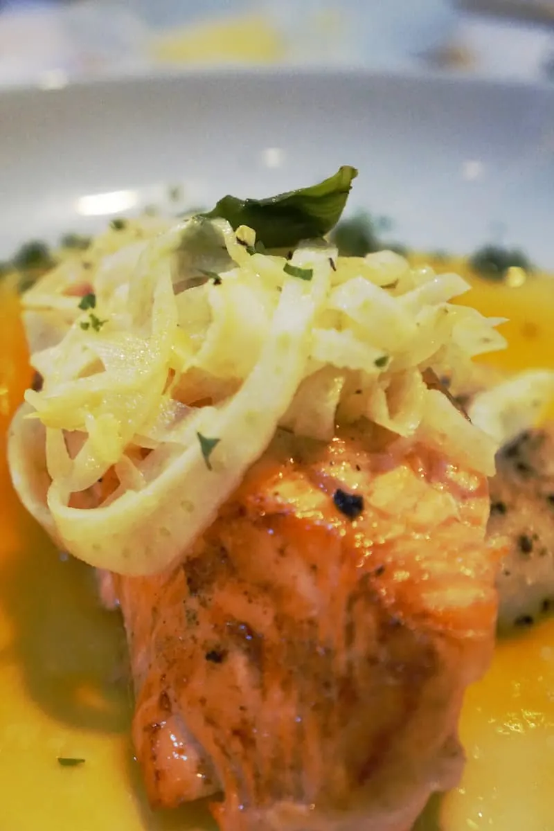 steelhead trout entree topped with fennel in orange sauce