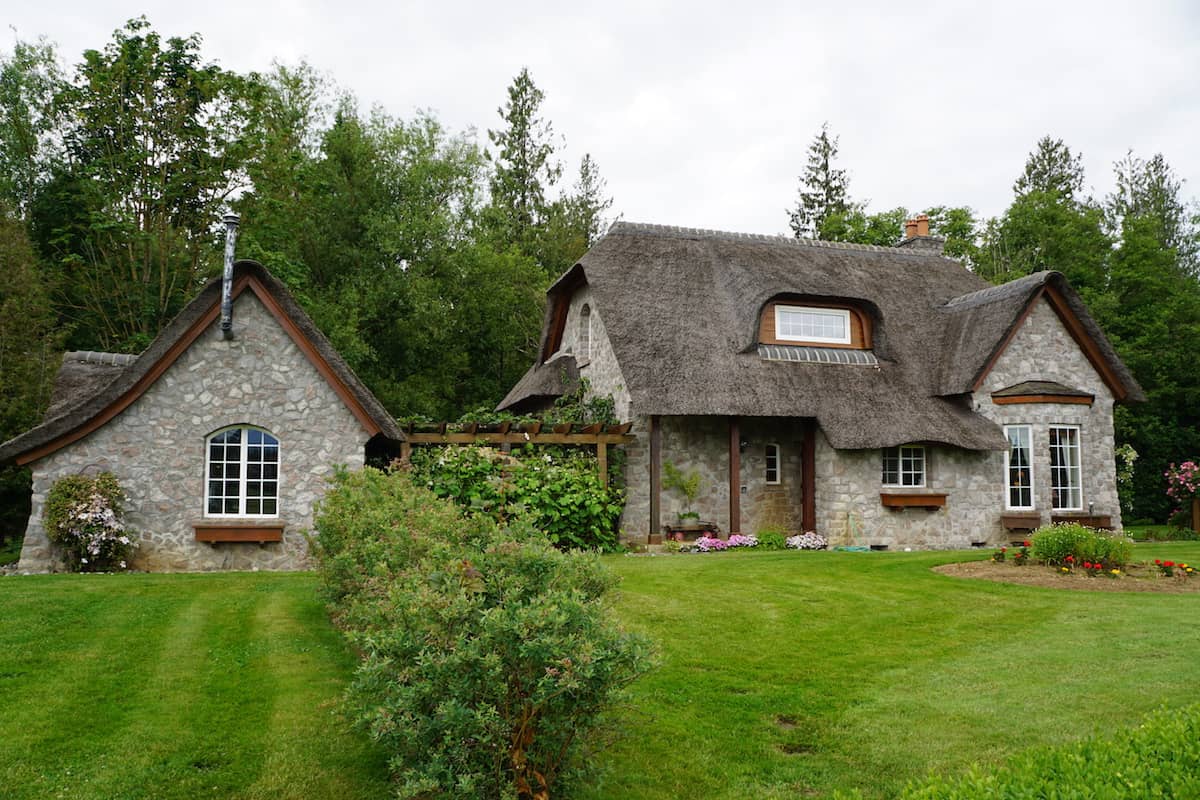 House with thatched roof. One of the best things to do in Lynden if you want to be active is to walk, hike, jog or bike Jim Kaemingk Sr Trail. #storybrookhouse #thingstodoinLynden #washington