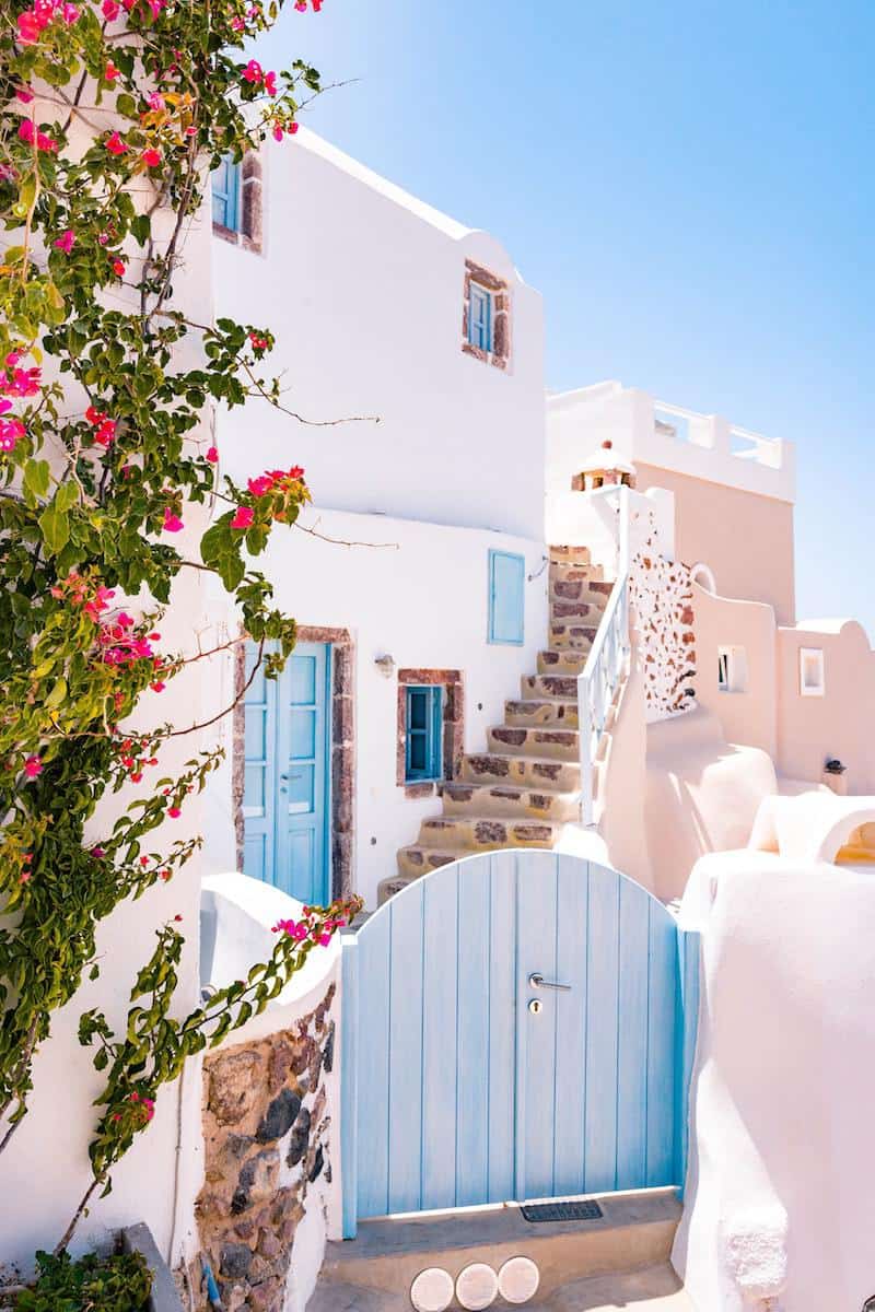 closed blue gate photo oia greece