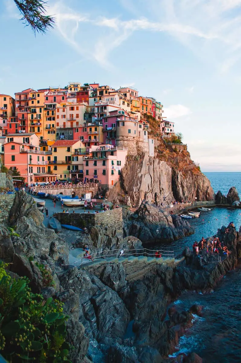 colorful homes on Italian hillside overlooking the ocean