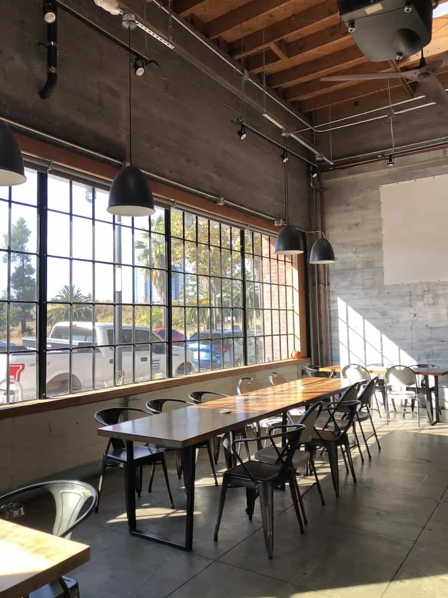 brewery interior, steel chairs and wood table