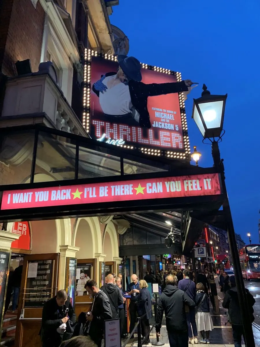 people buying tickets for a theatre show in west end