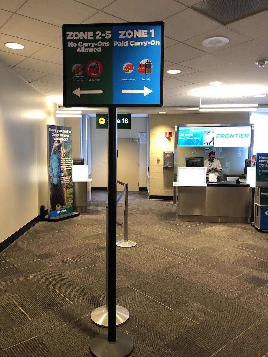 Frontier boarding zone signs at gate at airport