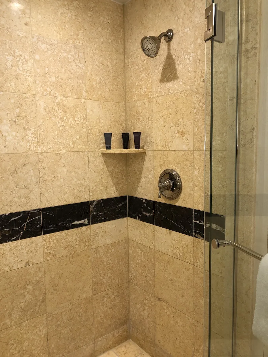 cream colored marble tiled in shower at the palazzo las vegas