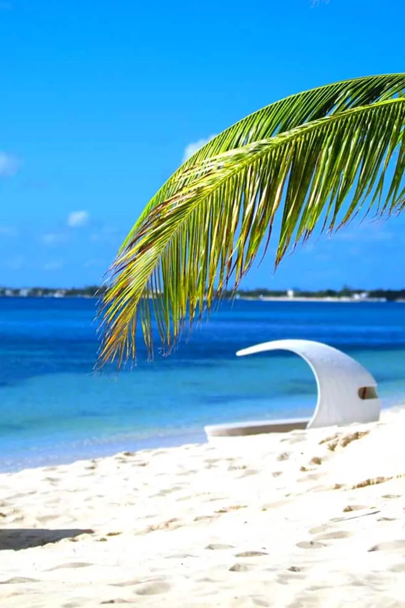 white beach cabana on white sand beach in the Caribbean