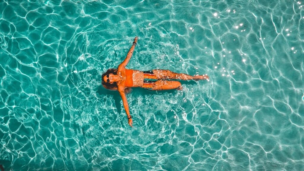 woman splashing alone in body of water, isle of palms