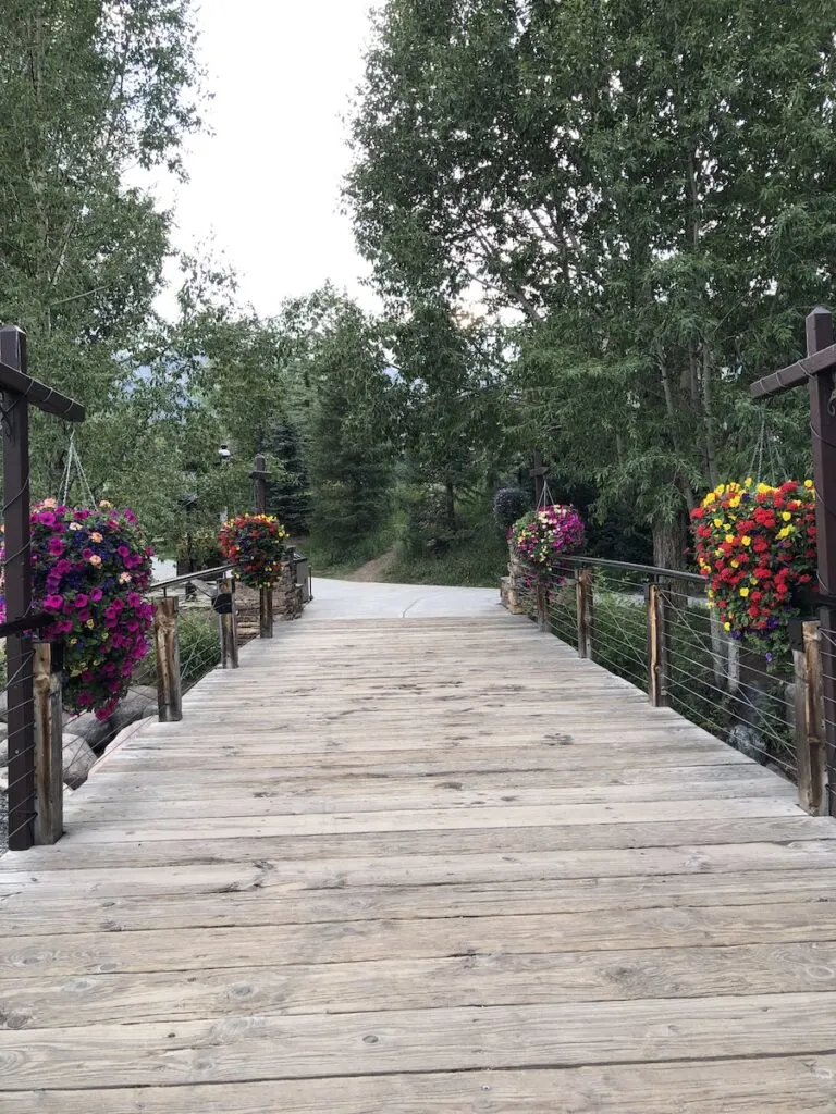 flower lined bridge, Blue River Plaza walking trail Breckenridge, Colorado