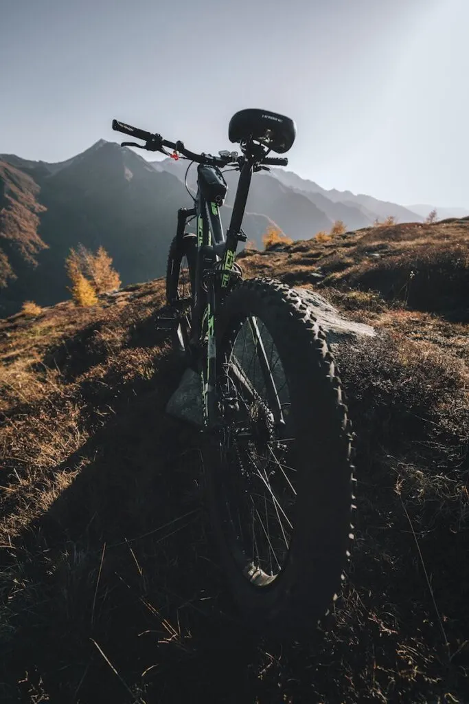 black and green bicycle on mountain