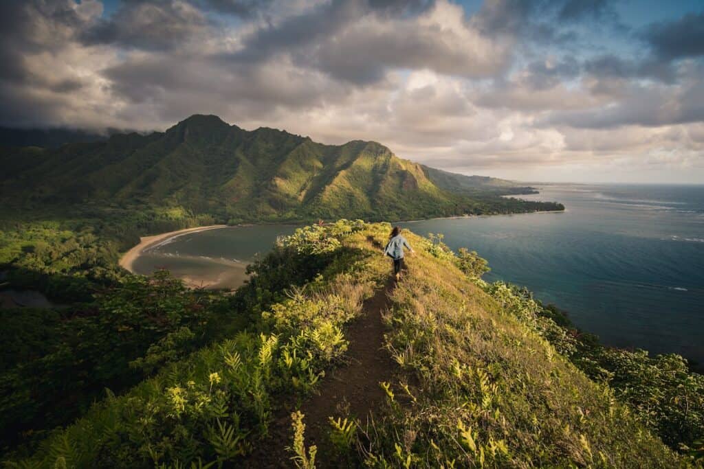 woman standing on a hill on islet in Hawaii