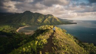 woman standing on a hill in islet in Hawaii