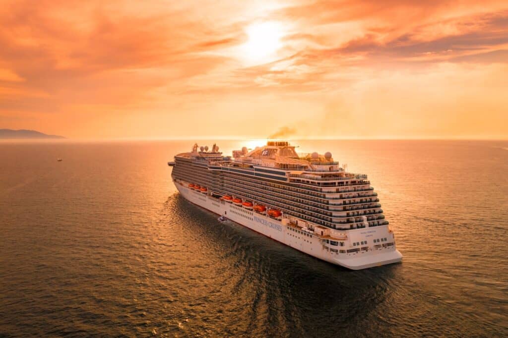 white ship on sea during sunset; earn miles and points without a credit card with cruises