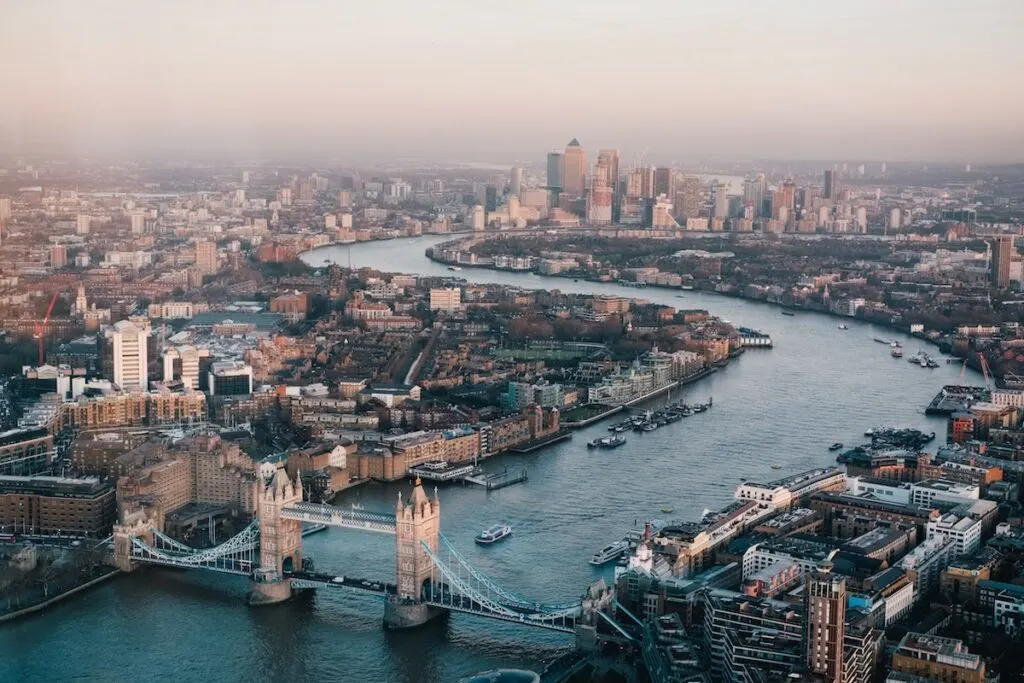 aerial view of modern industrial city with bridge and s shaped river. aerial photography of London